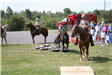 Mounted officers doing obstacle course with onlookers