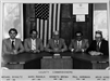 Black and white image of commissioners from 1970s to 1980s