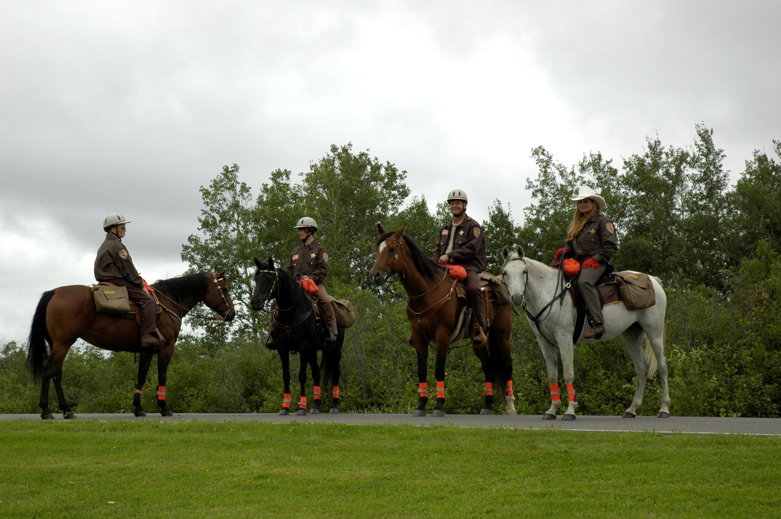 Four mounted officers with emergency packs